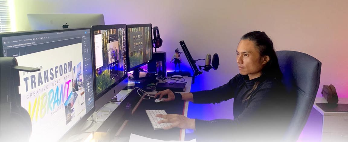 Zaid editing at a multi-screen workstation